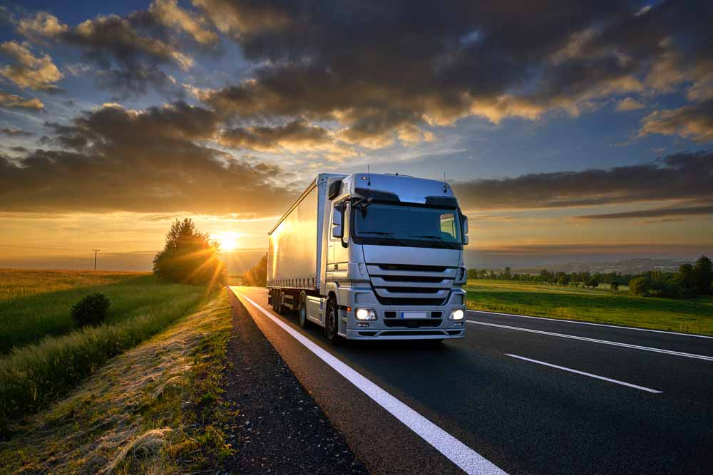 semi truck on road at night